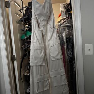Sleeveless Wide-Leg Jumpsuit with Utility Pockets - Cream Faux Leather.